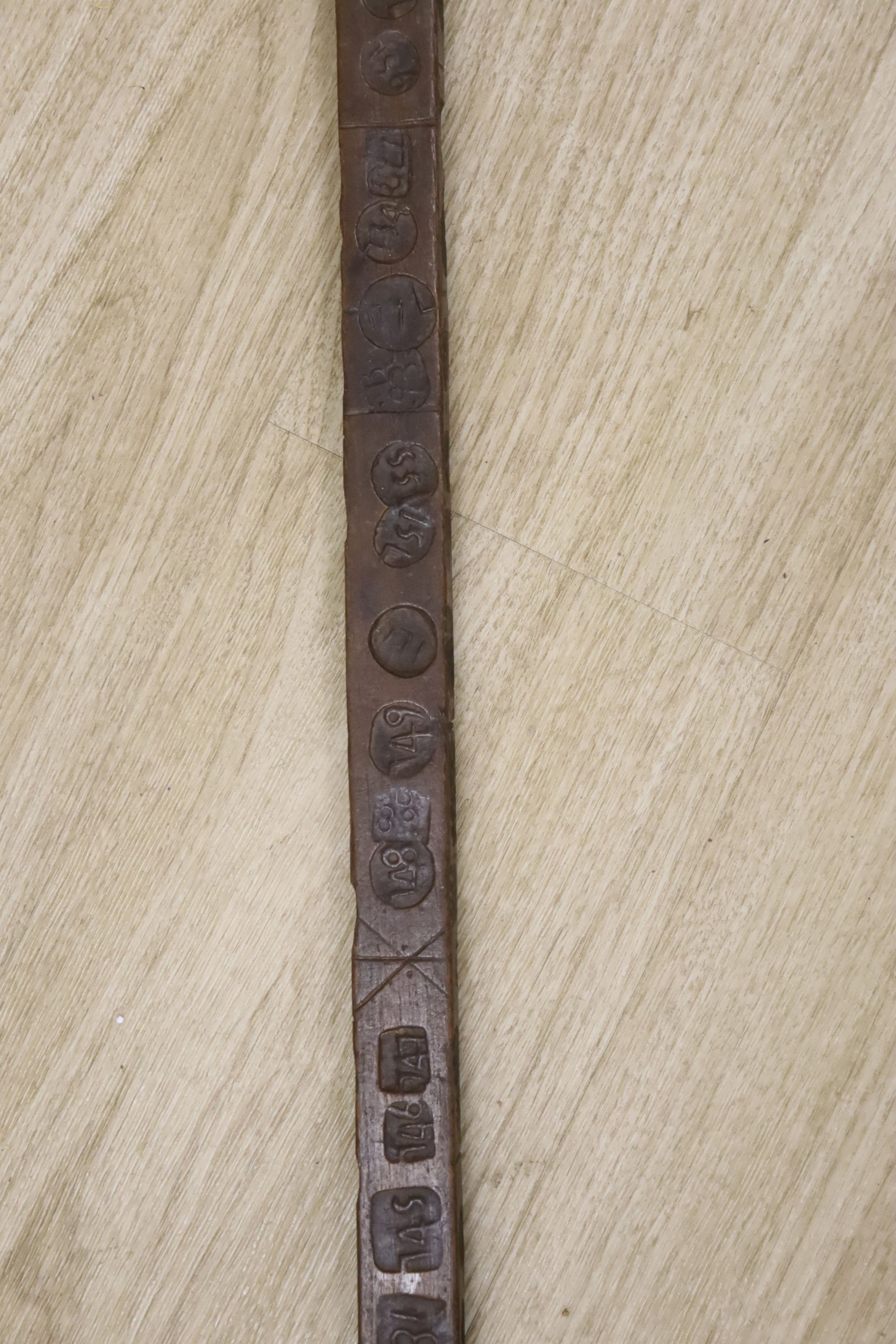 An unusual 18th/19th century rule/gauge or tally stick with impressed numerals, 26cm long